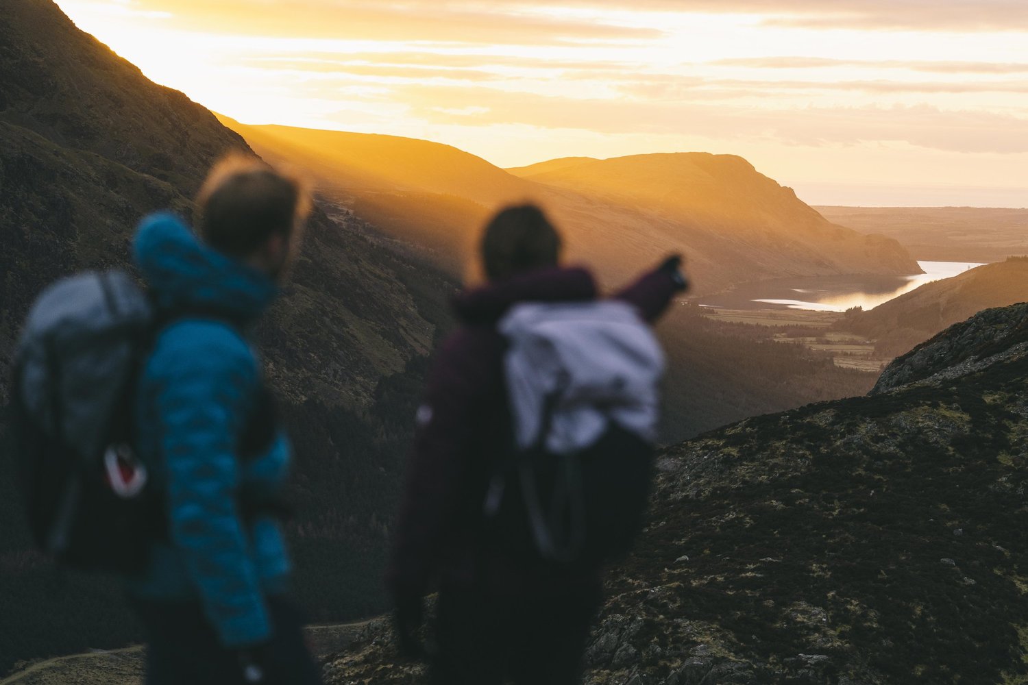 Two walkers on a fell path in the Lake District