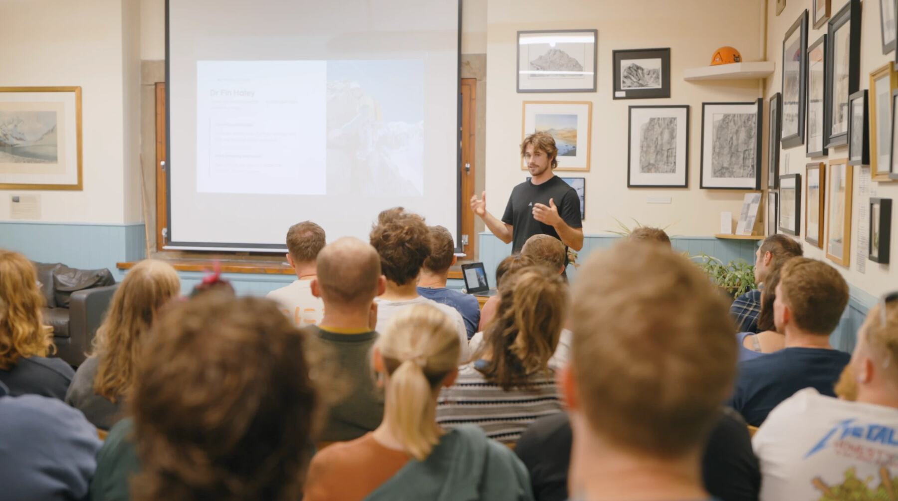 Dr Fin Haley presenting the Fear of Falling talk to a full room